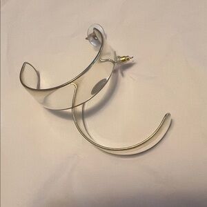 Clear 2 inch hoops rimmed in gold tone